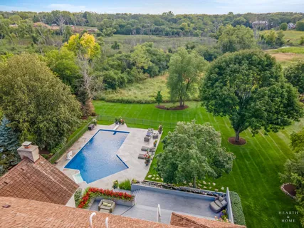 an aerial view of a house with a yard