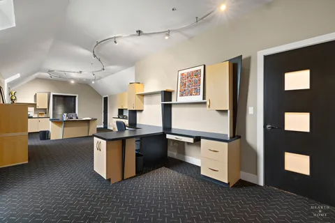 a kitchen with stainless steel appliances granite countertop a stove a sink dishwasher and a refrigerator