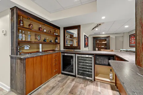 a kitchen with stainless steel appliances granite countertop a stove and cabinets