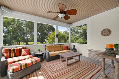 a outdoor space with patio couch and a large window