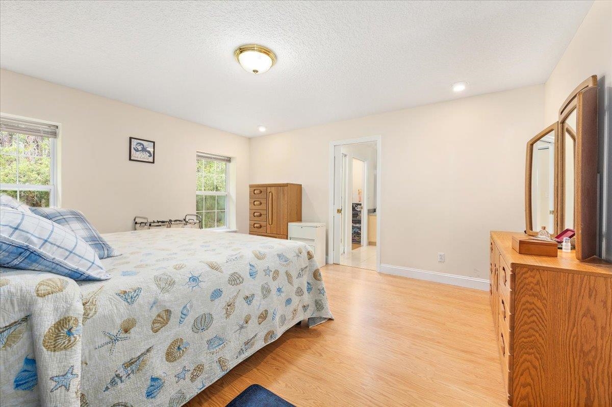 3180 B Pacetti Road St. Augustine, FL 32092 - Photo 11 of 42 a bedroom with a large bed and a dresser