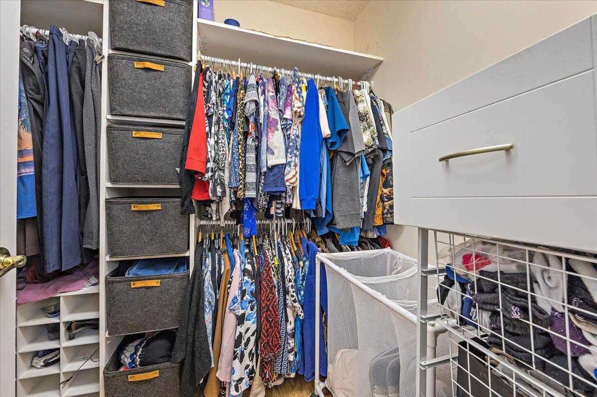 3180 B Pacetti Road St. Augustine, FL 32092 - Photo 14 of 42 a view of walk in closet with clothes and shoes