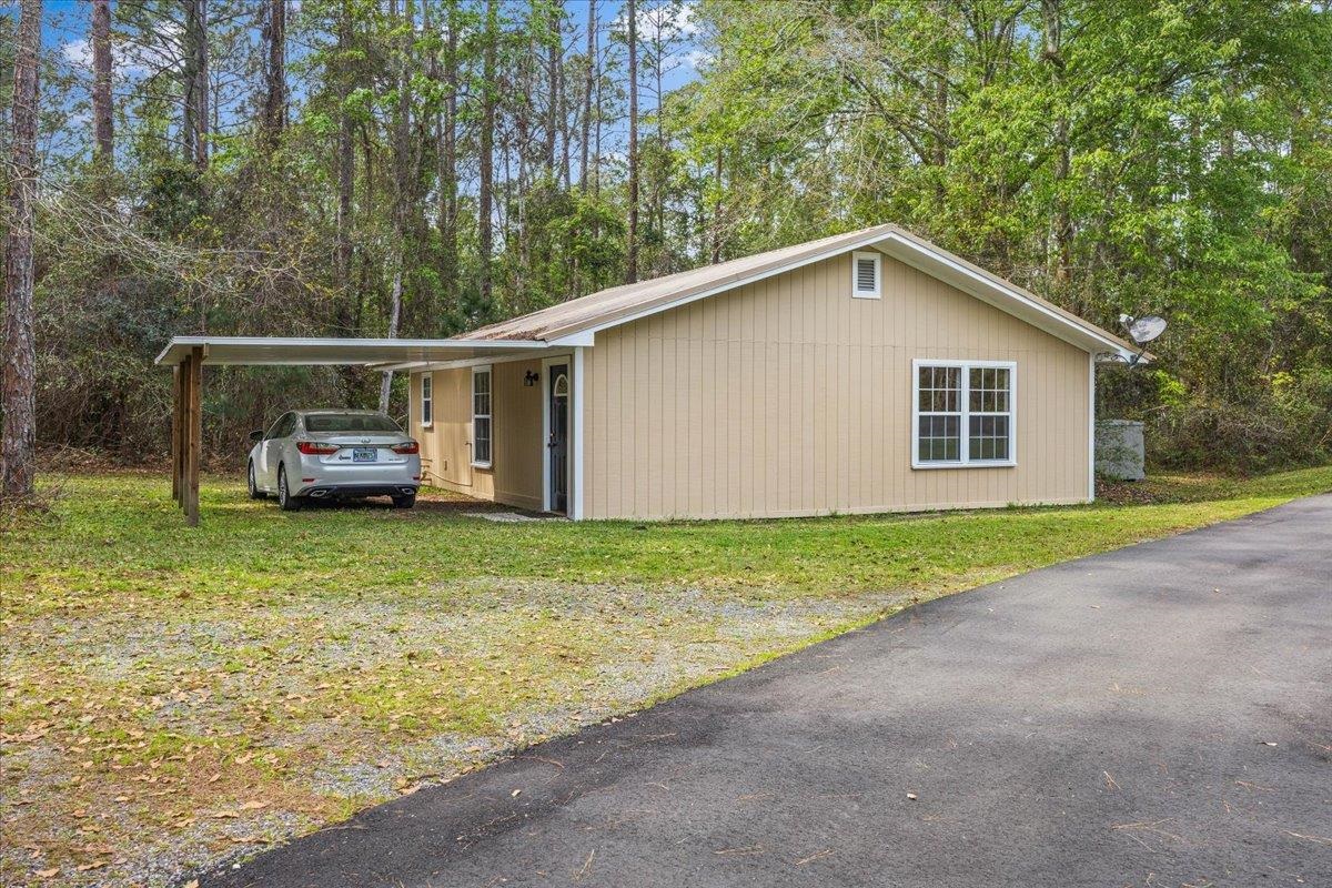 3180 B Pacetti Road St. Augustine, FL 32092 - Photo 29 of 42 a front view of a house with a garden and yard