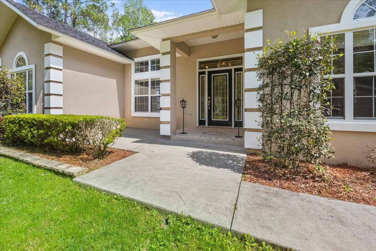 3180 B Pacetti Road St. Augustine, FL 32092 - Photo 3 of 42 a front view of a house with garden