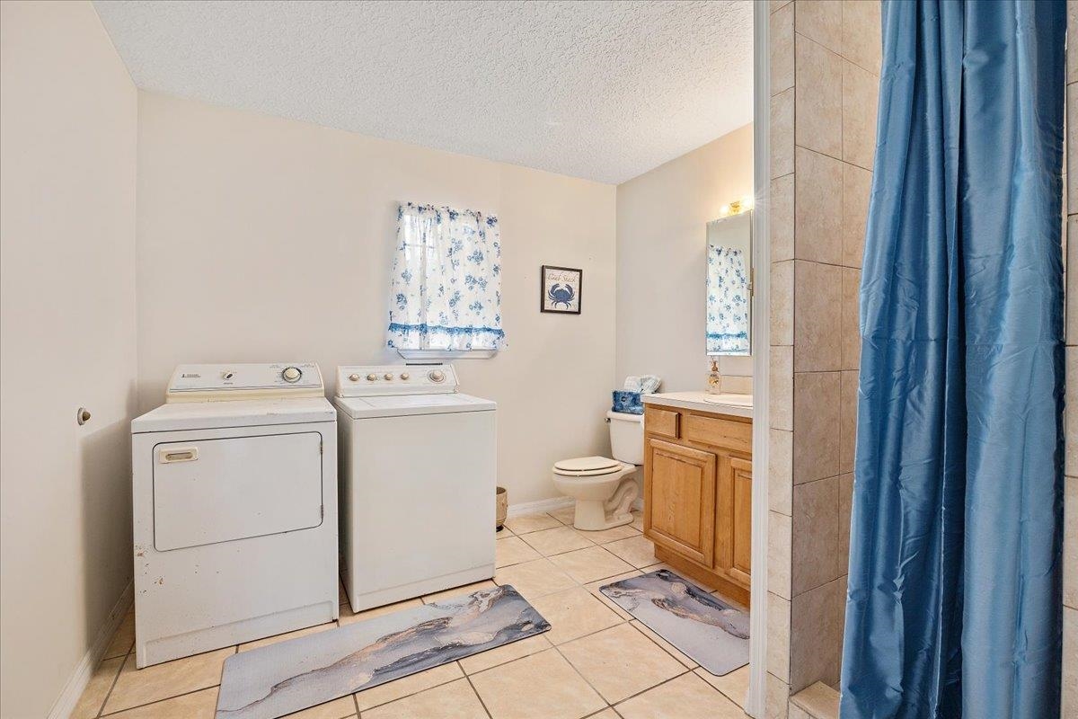 3180 B Pacetti Road St. Augustine, FL 32092 - Photo 33 of 42 a view of a bathroom with a washer and dryer