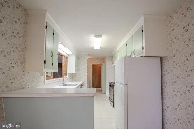 a bathroom with a shower sink and mirror