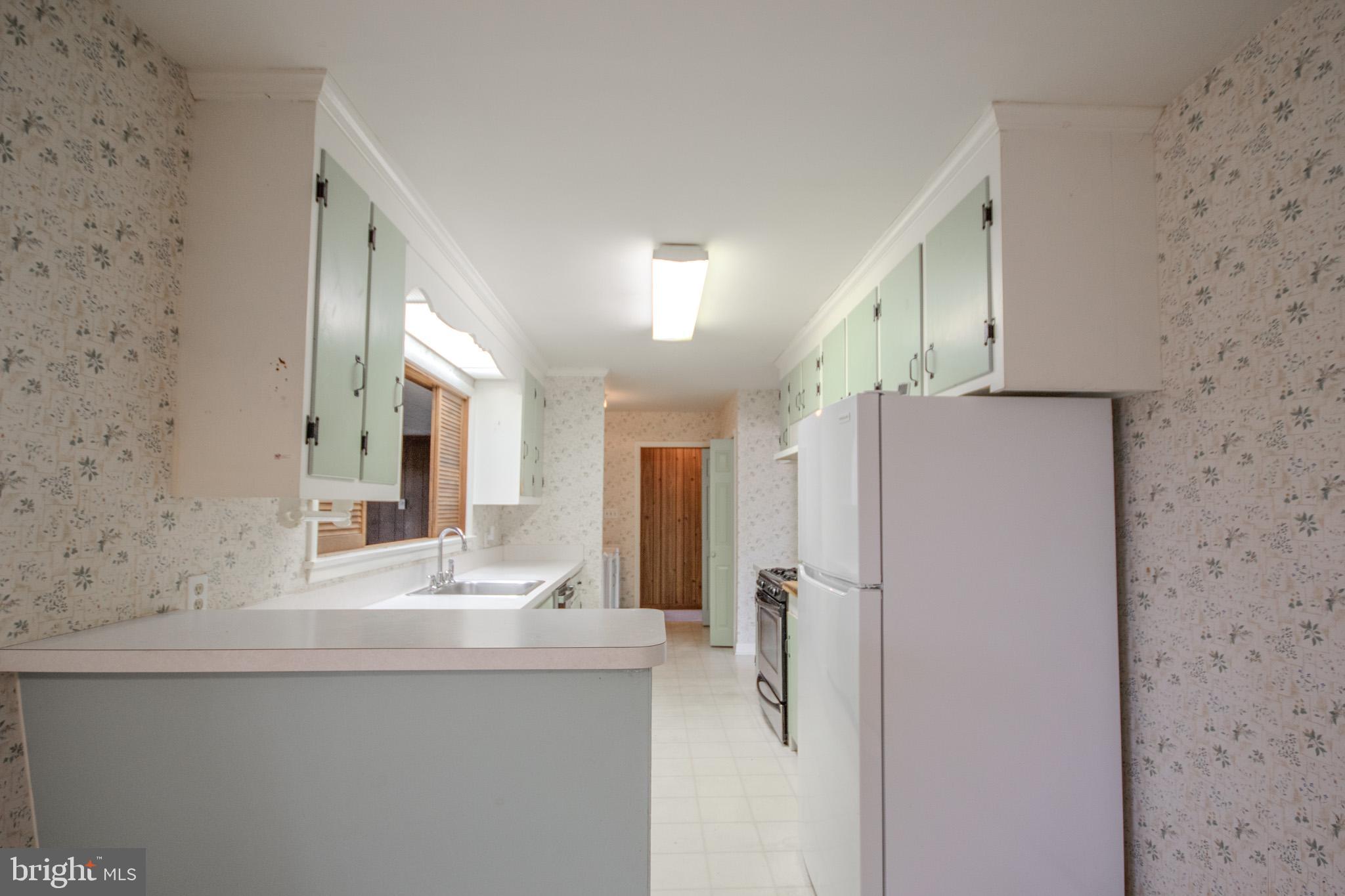 633 Ridge Road Salisbury, MD 21801 - Photo 12 of 45 a bathroom with a shower sink and mirror