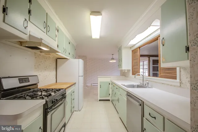 a kitchen with a stove and a sink