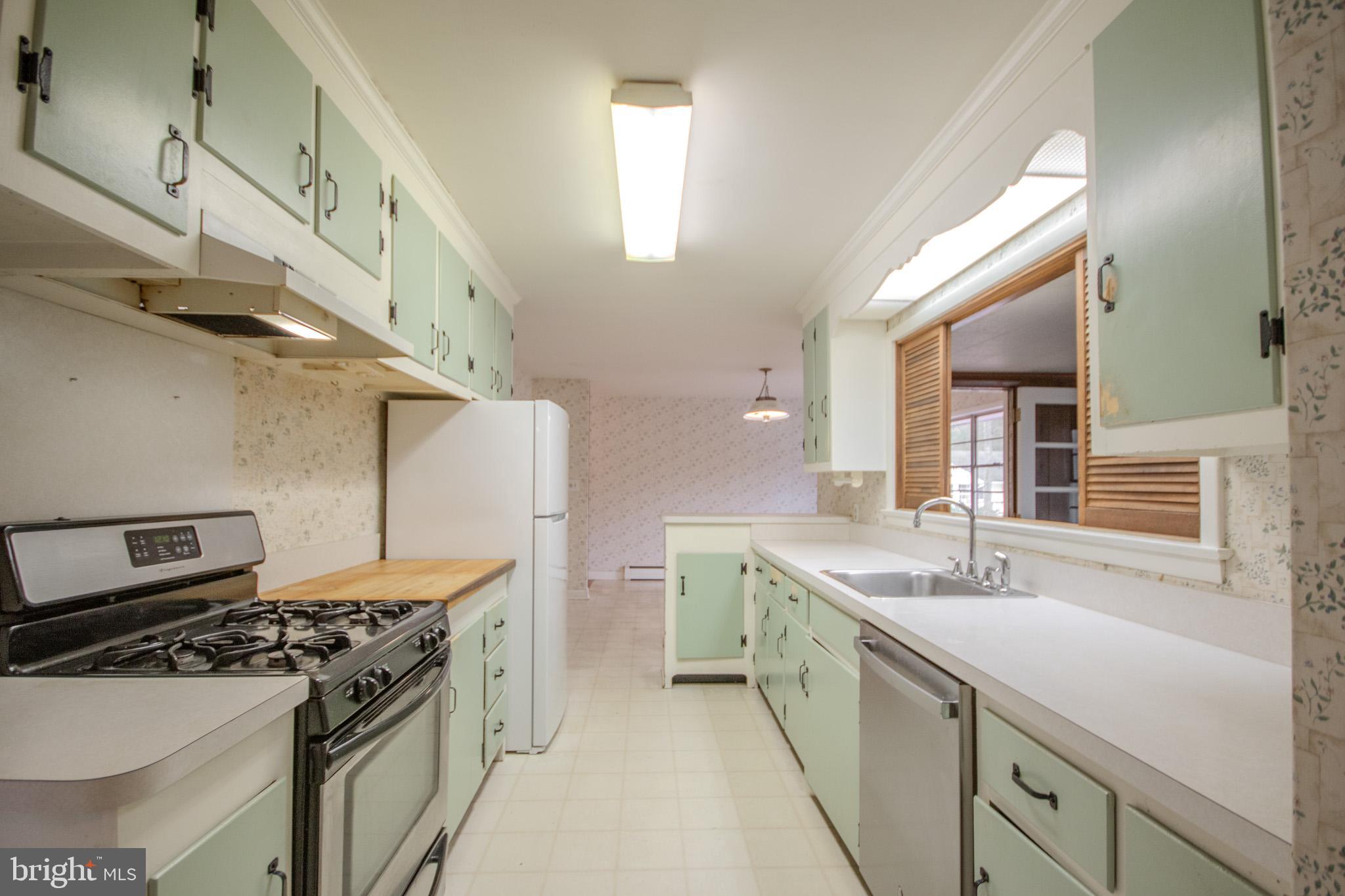 633 Ridge Road Salisbury, MD 21801 - Photo 14 of 45 a kitchen with a stove and a sink