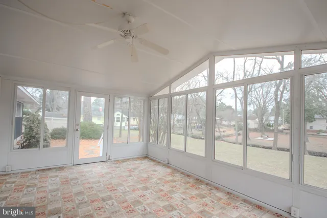 a bedroom with furniture and window