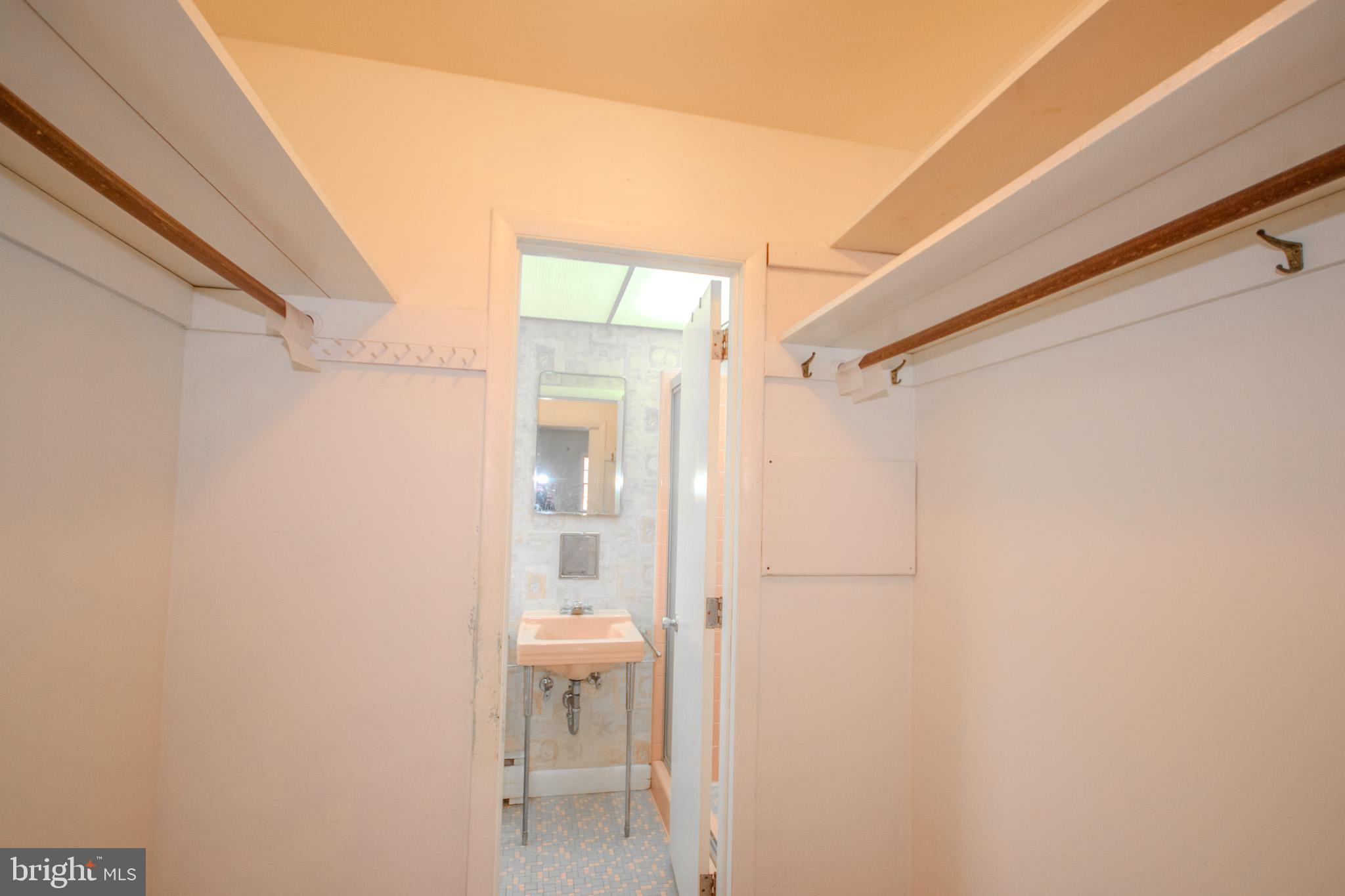 633 Ridge Road Salisbury, MD 21801 - Photo 22 of 45 a bathroom with a glass shower door and a sink
