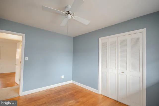 a bathroom with a sink a vanity and a shower curtain