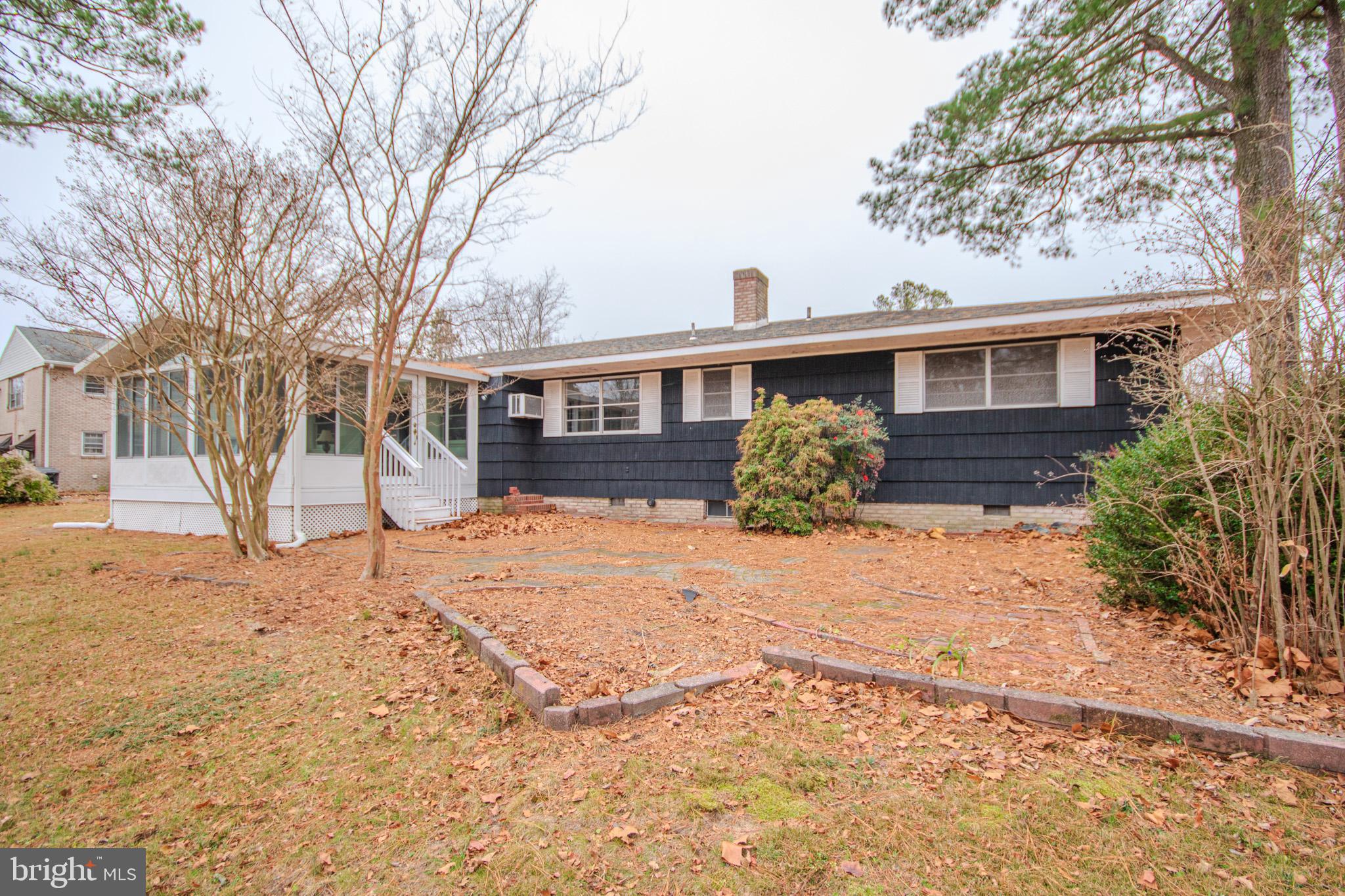 633 Ridge Road Salisbury, MD 21801 - Photo 39 of 45 a front view of a house with a yard covered in snow