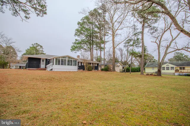 a house with trees in front of it