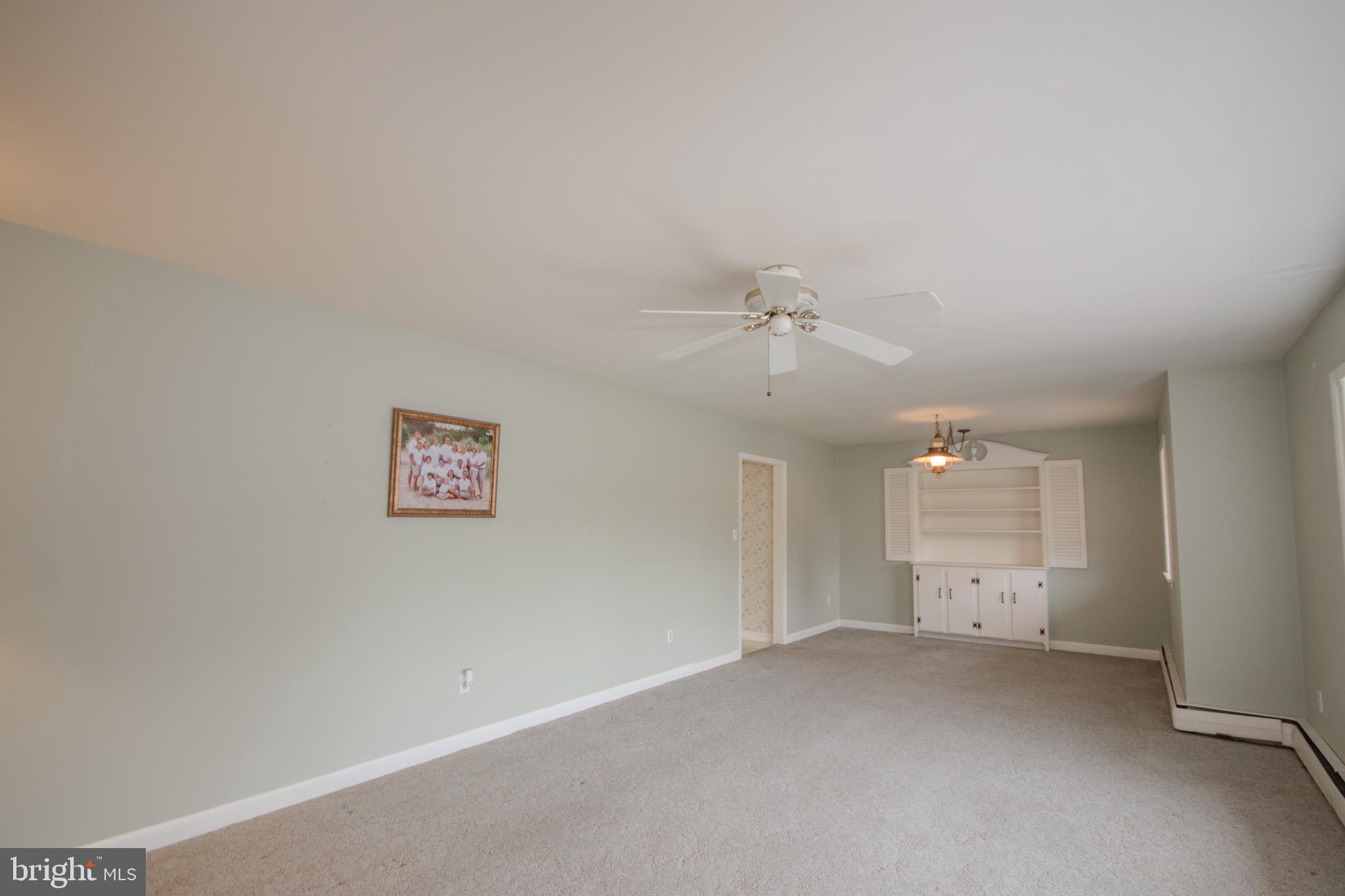 633 Ridge Road Salisbury, MD 21801 - Photo 6 of 45 an empty room with a empty space and windows