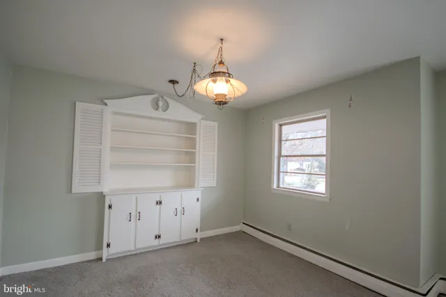 an empty room with chandelier