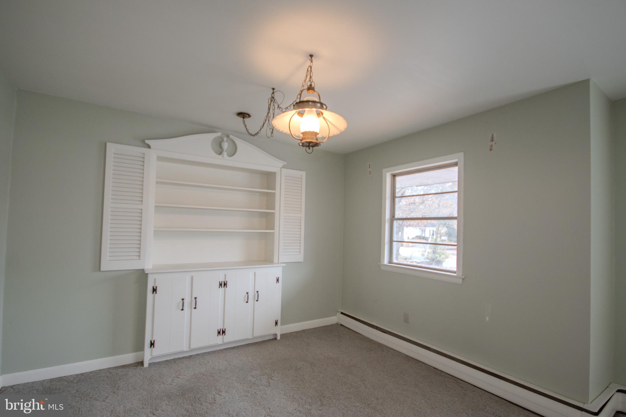 633 Ridge Road Salisbury, MD 21801 - Photo 8 of 45 an empty room with chandelier