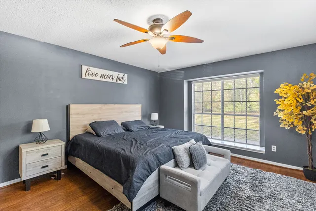 a bedroom with a bed and window