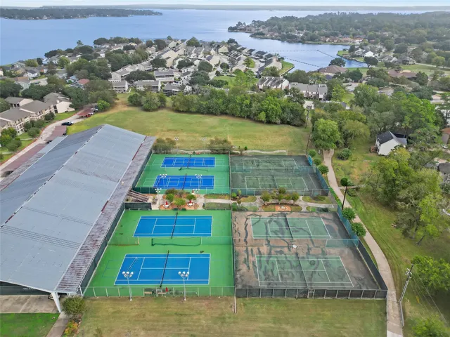an aerial view of residential houses with outdoor space