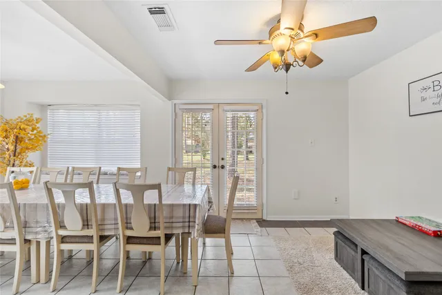 a dining room with furniture and window
