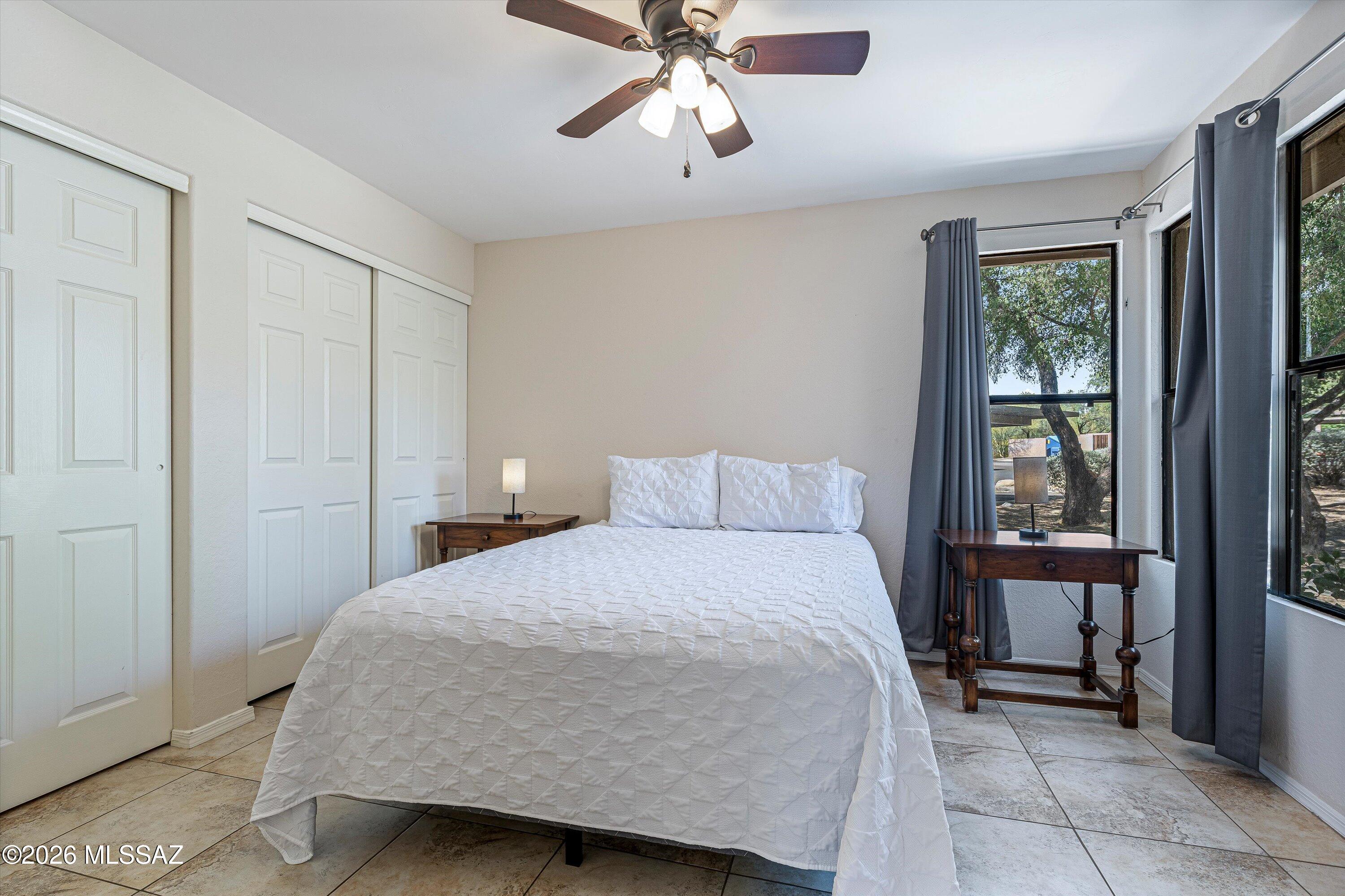 5800 North Kolb Road, Unit 5125 Tucson, AZ 85750 - Photo 20 of 34 a bedroom with a bed and window