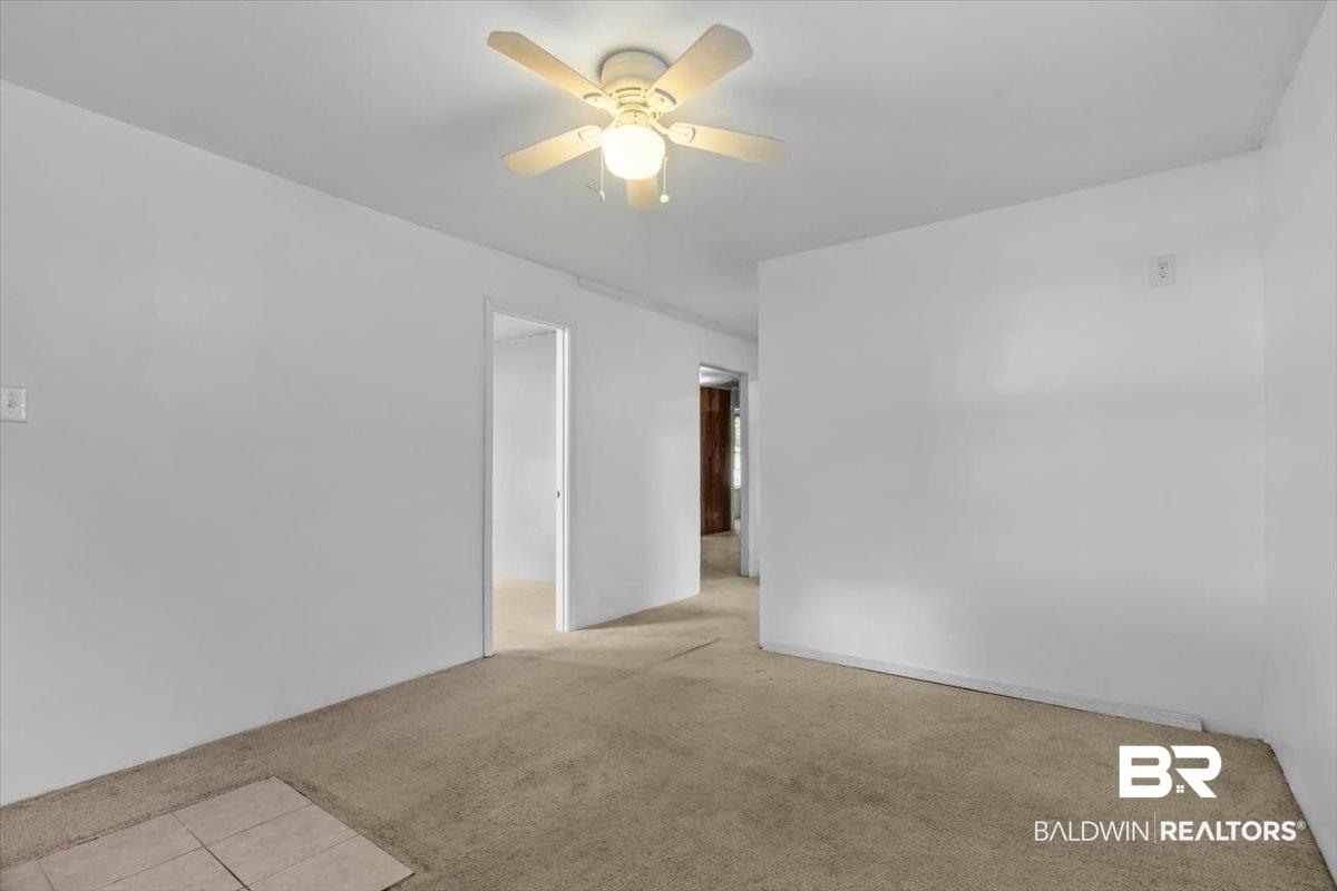 4918 Quimby Drive Mobile, AL 36619 - Photo 29 of 38 Carpeted empty room featuring a ceiling fan