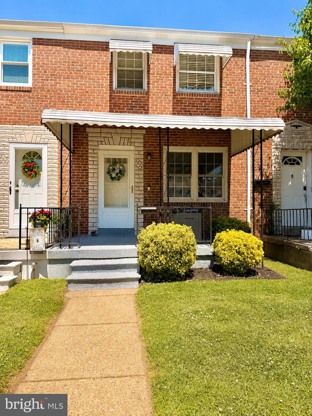 2235 Southorn Road Baltimore, MD 21220 - Photo 2 of 33 a front view of a house with a garden