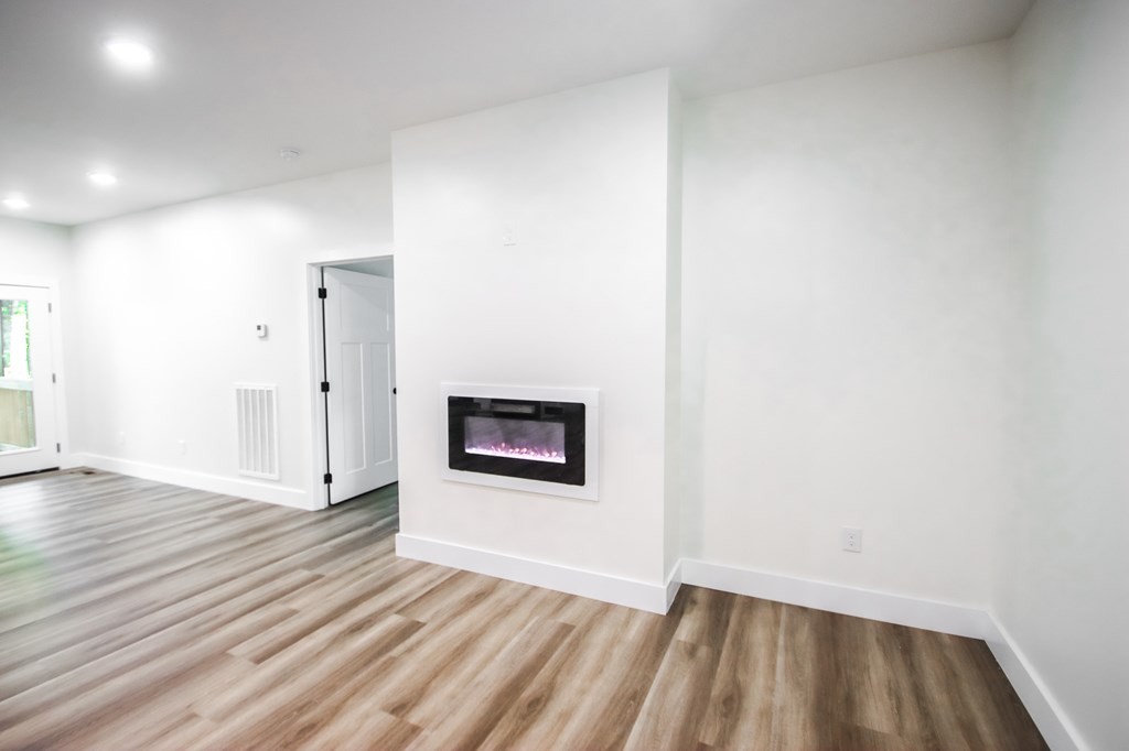 329 Webb Drive Sparta, TN 38583 - Photo 6 of 17 a view of a hallway with wooden floor