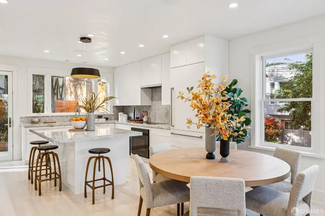 a kitchen with a table and chairs in it