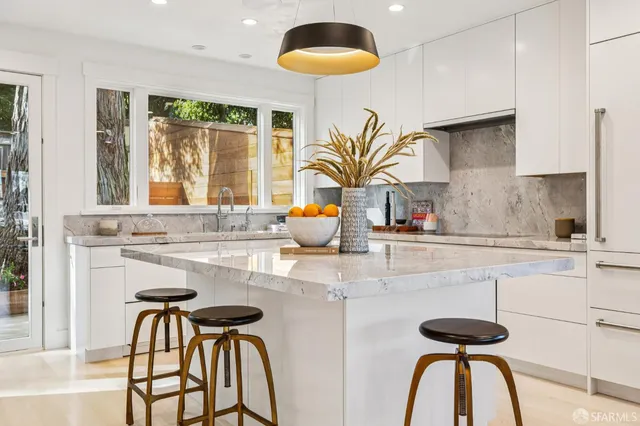 a kitchen with a table and chairs in it