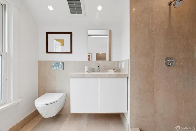 a view of entryway and livingroom with wooden floor