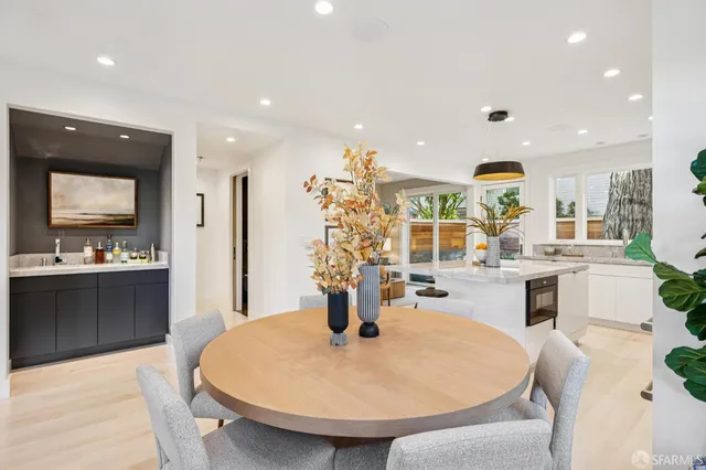 a kitchen with stainless steel appliances kitchen island granite countertop a sink and cabinets