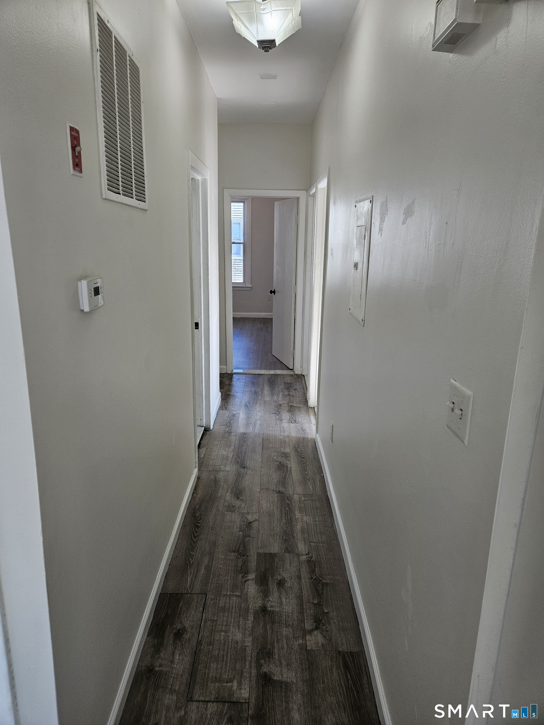 236 Brooks Street, Unit 236 Bridgeport, CT 06608 - Photo 9 of 12 a view of a hallway with wooden floor