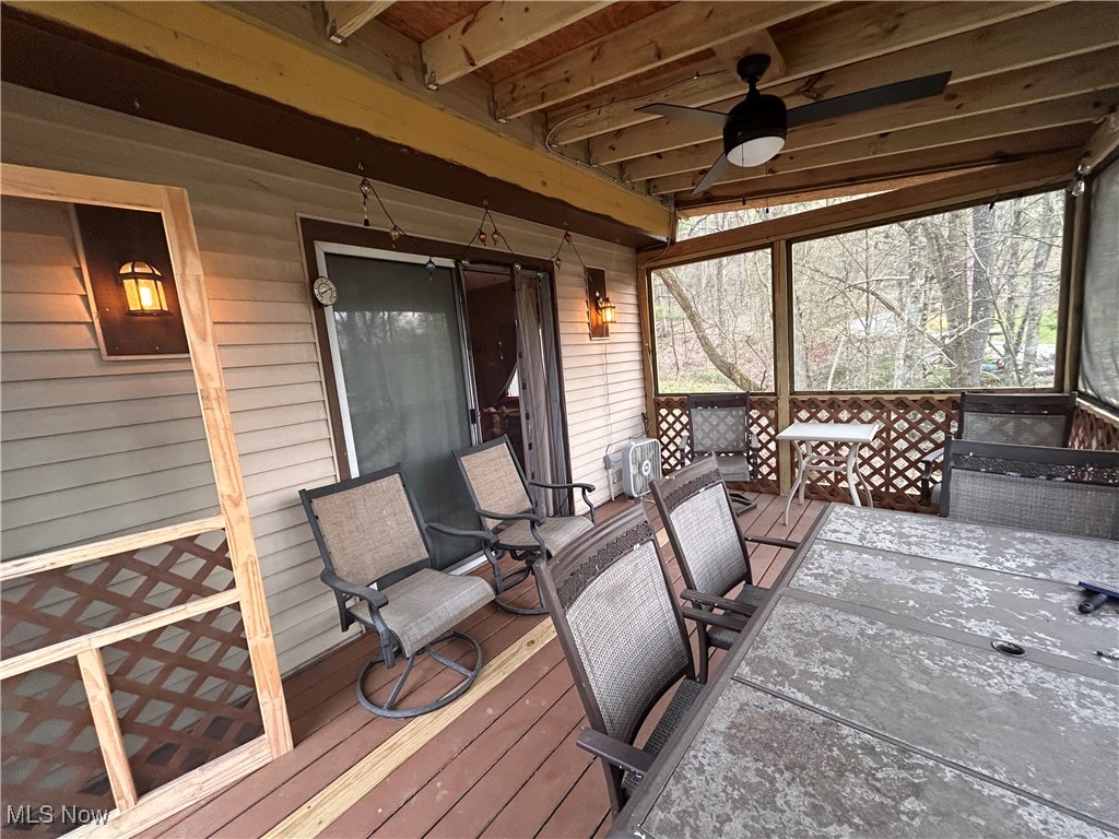 32290 Richey Lane Freeport, OH 43973 - Photo 8 of 20 Deck with a ceiling fan and outdoor dining area