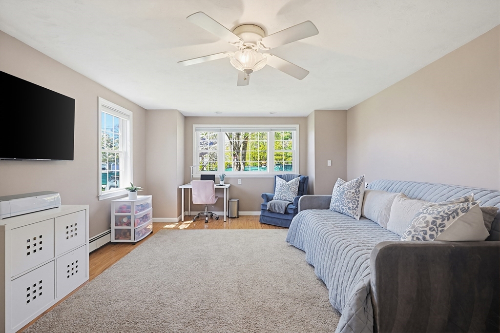 18 Anchorage Road Franklin, MA 02038 - Photo 22 of 42 a living room with furniture and a flat screen tv