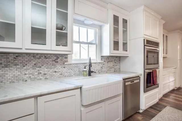 a kitchen with a sink and cabinets