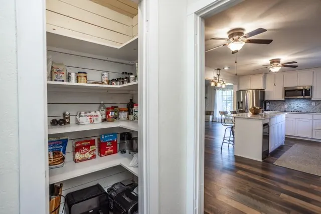 a view of a kitchen with appliances and cabinets