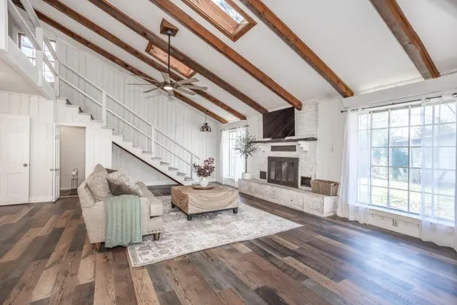 a living room with furniture and a fireplace