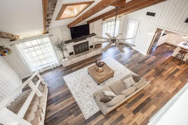 a living room with furniture and a flat screen tv