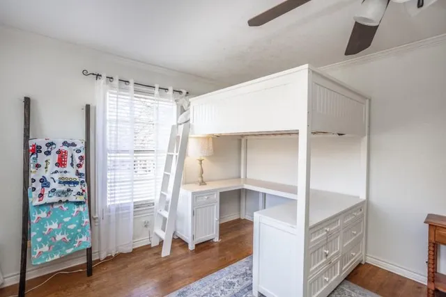 a view of entryway with wooden floor and cabinet