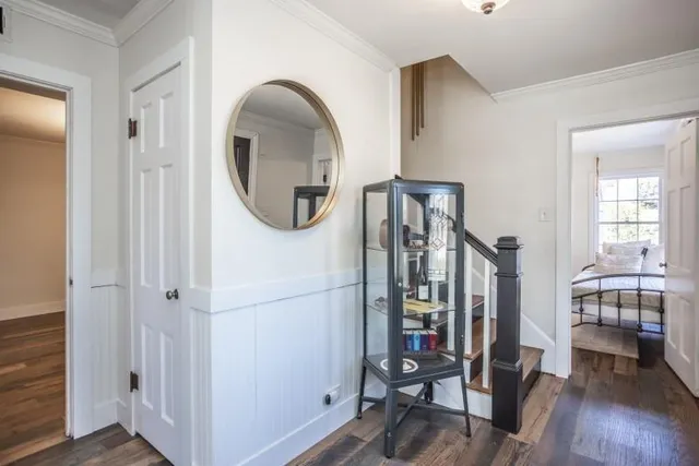 a view of a livingroom with furniture and hardwood floor
