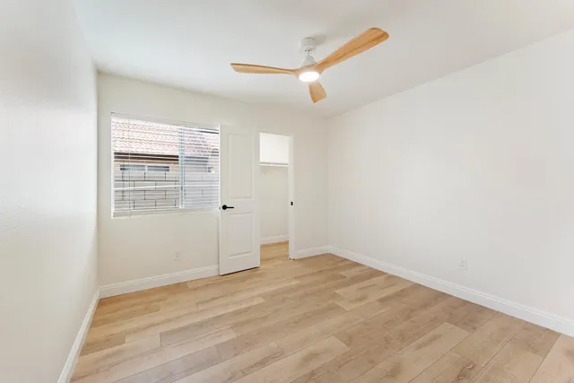 a bathroom with a double vanity sink toilet mirror and shower