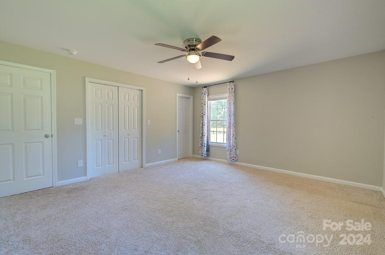 6130 Hopewell Road Hickory Grove, SC 29717 - Photo 12 of 29 a view of an empty room and a ceiling fan
