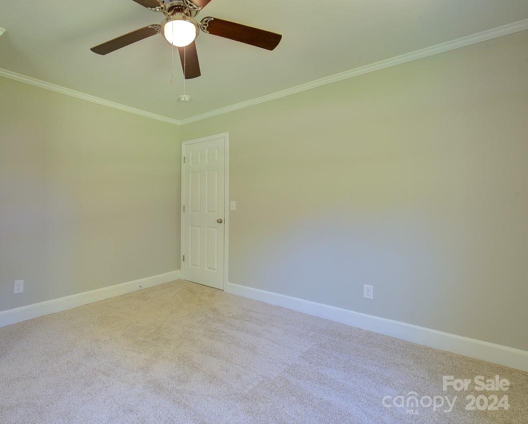6130 Hopewell Road Hickory Grove, SC 29717 - Photo 16 of 29 an empty room with a window and a fan