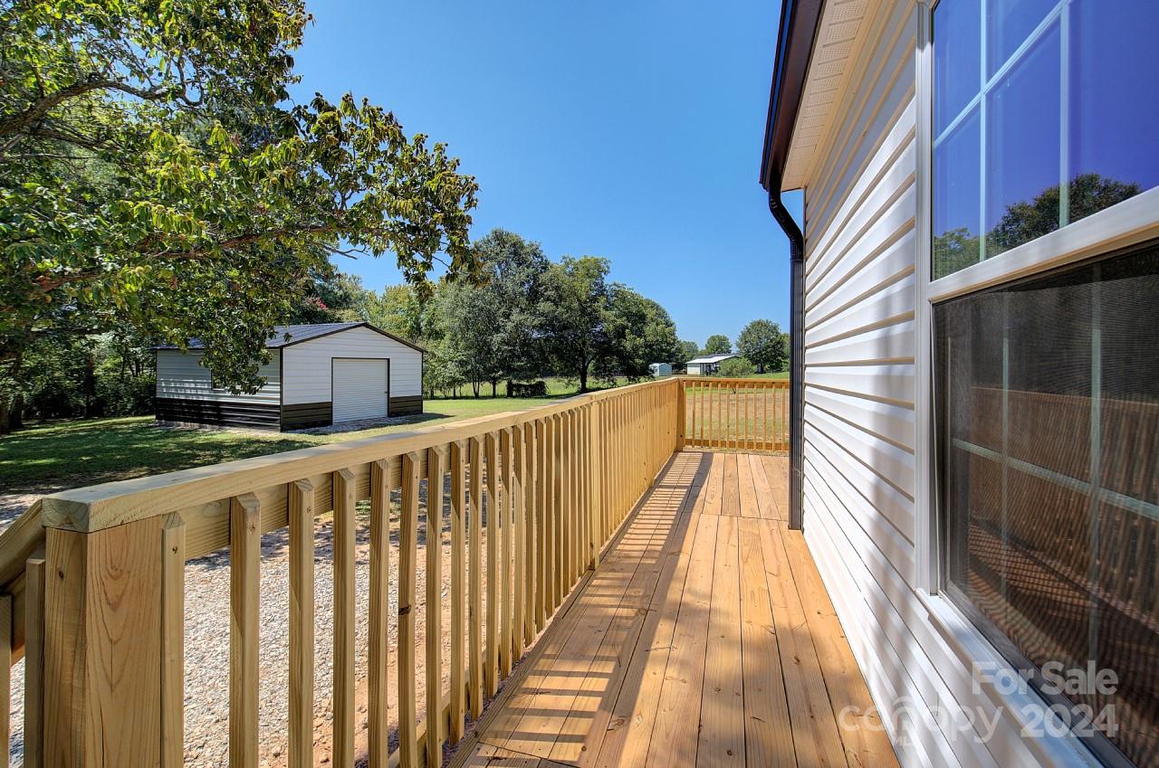 6130 Hopewell Road Hickory Grove, SC 29717 - Photo 20 of 29 a view of a balcony with wooden floor and fence