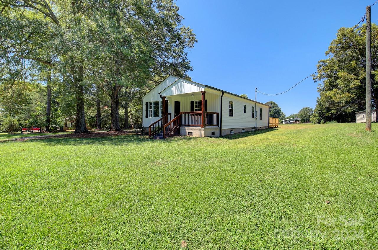 6130 Hopewell Road Hickory Grove, SC 29717 - Photo 2 of 29 a front view of a house with garden