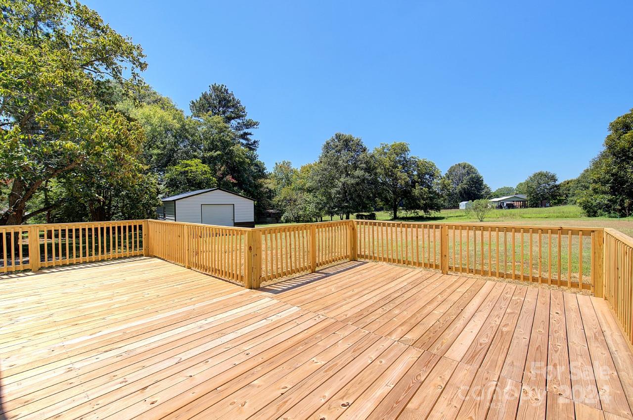 6130 Hopewell Road Hickory Grove, SC 29717 - Photo 21 of 29 a view of balcony with wooden floor and trees around