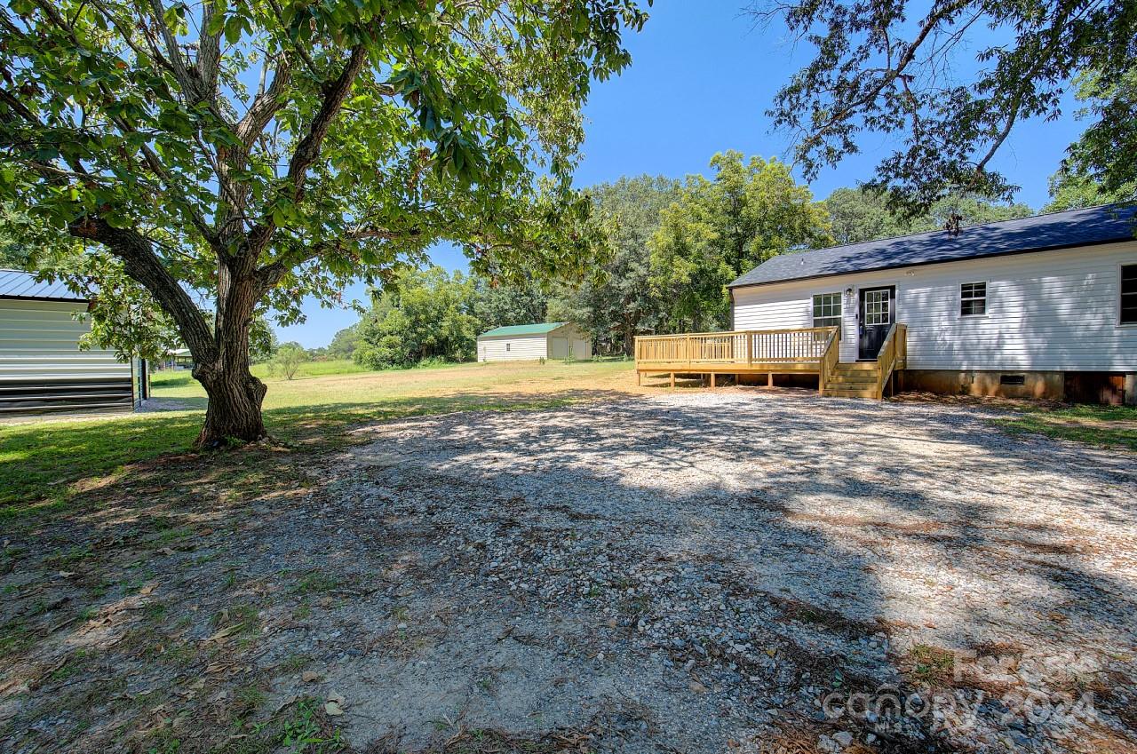 6130 Hopewell Road Hickory Grove, SC 29717 - Photo 23 of 29 a view of a house with a yard