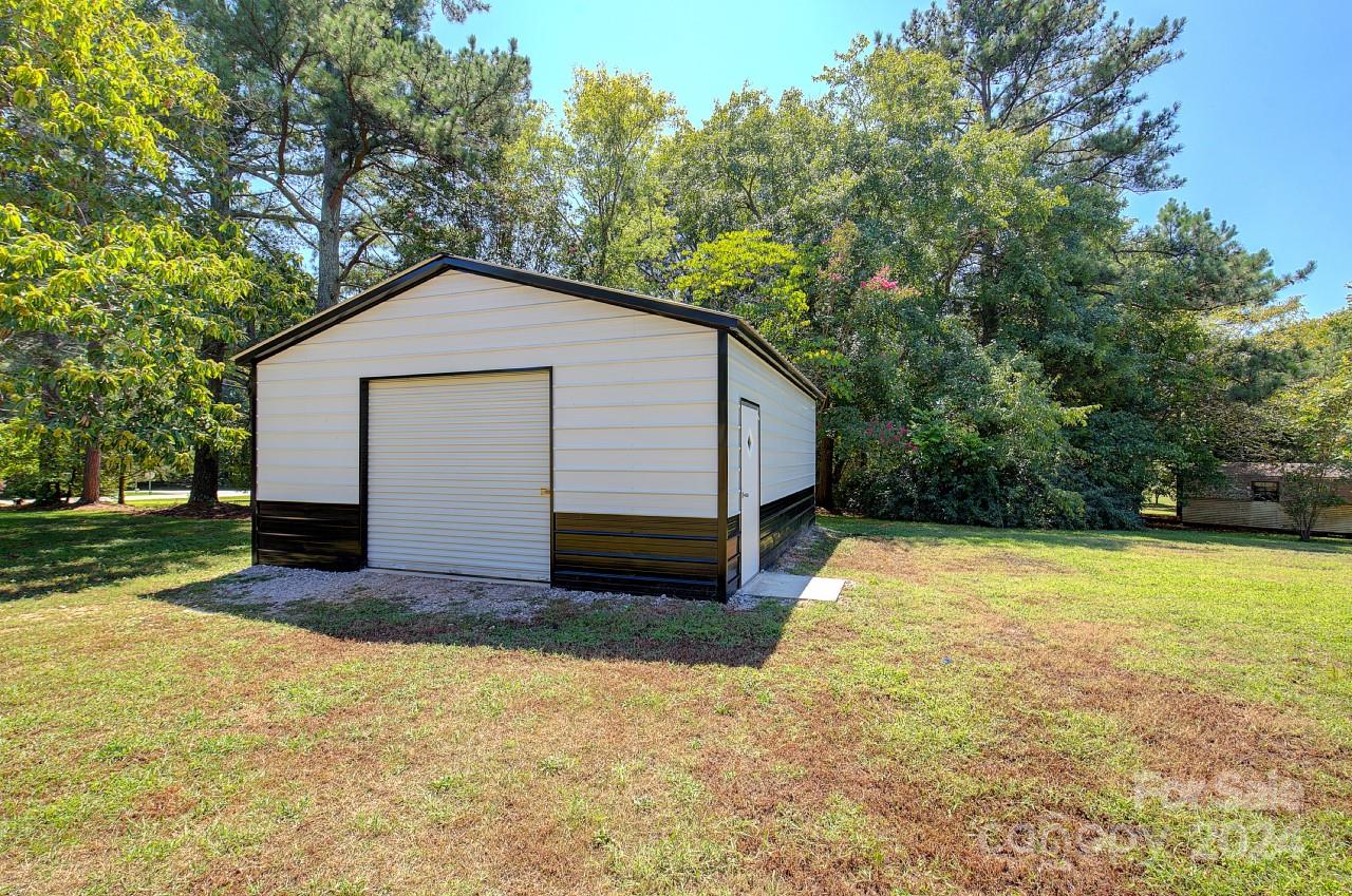 6130 Hopewell Road Hickory Grove, SC 29717 - Photo 25 of 29 a view of a house with a yard and tree