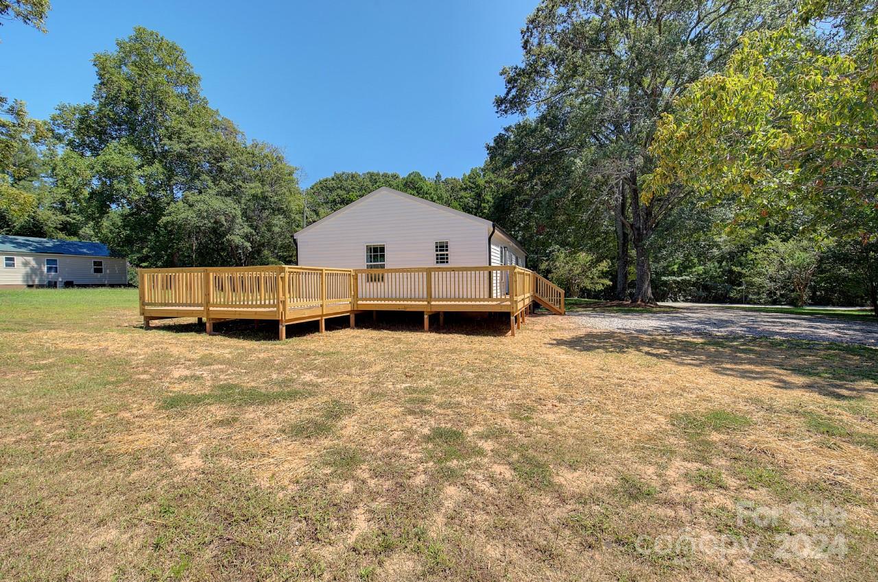 6130 Hopewell Road Hickory Grove, SC 29717 - Photo 28 of 29 a front view of a house with a yard and large trees